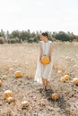 woman yellow pumpkin holds hands subject Halloween