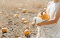 woman yellow pumpkin holds hands subject Halloween