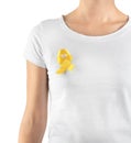 Woman with yellow ribbon on t-shirt against white background. Cancer awareness concept Royalty Free Stock Photo