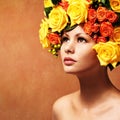 Woman with Yellow Roses. Model Girl with Flowers Hair Royalty Free Stock Photo