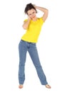 Woman in yellow shirt and jeans standing Royalty Free Stock Photo