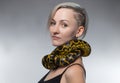 Woman with yellow snake on her neck Royalty Free Stock Photo