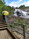 Woman yellow umbrella water montain Royalty Free Stock Photo