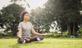 woman yoga and meditate in the lotus position at park