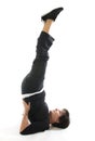 woman yoga position half shoulderstand