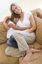 Woman and young girl sitting in living room Royalty Free Stock Photo