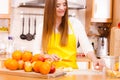 Woman housewife in kitchen cutting apple fruits Royalty Free Stock Photo