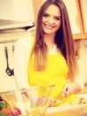 Woman housewife in kitchen cutting apple fruits Royalty Free Stock Photo