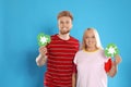 Woman and young man with recycling symbols on background Royalty Free Stock Photo