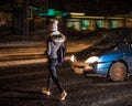 Woman on zebra crossing at night