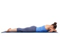 Womand relax in Hatha yoga asana Makarasana