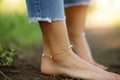 womans ankle with a dainty gold anklet