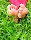 Womans barefeet on grass Royalty Free Stock Photo