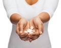 Womans cupped hands showing euro coins