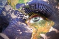 Womans face with planet Earth texture and iraqi flag inside the eye Royalty Free Stock Photo
