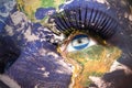 Womans face with planet Earth texture and nicaraguan flag inside the eye