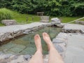 Womans feet against facility for Kneipp treatment outdoors, Bayrischzell Royalty Free Stock Photo