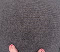 Womans feet on office carpet texture Royalty Free Stock Photo