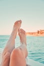 Girl relaxing on the yacht. Womans feet on the yacht