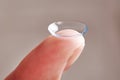 Womans finger with contact lens Royalty Free Stock Photo