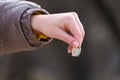 Womans hand and coin. Financial contribution concept Royalty Free Stock Photo