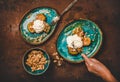 Womans hand cutting Turkish pumpkin dessert with walnuts and cream Royalty Free Stock Photo