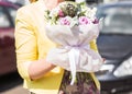 Womans hand is holding a bouquet of flowers Royalty Free Stock Photo