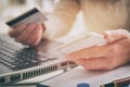 Womans hand holding credit card and smartphone Royalty Free Stock Photo