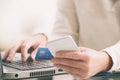 Womans hand holding credit card and smartphone Royalty Free Stock Photo