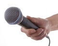 Womans hand holding microphone Royalty Free Stock Photo