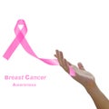 Womans hand holding pink breast cancer awareness ribbon Royalty Free Stock Photo