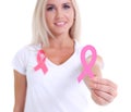 Womans hand holding pink breast cancer awareness ribbon Royalty Free Stock Photo