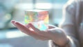 A womans hand holding a small translucent holographic cube its shifting colors and geometric patterns seeming to float