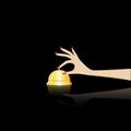 Womans hand rings the table bell at th reception, isolated on a black background, square vector illustration