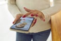 Womans hands hands choosing male profile in online dating application on smartphone