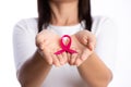 Womans hands holding pink breast cancer awareness ribbon on white background. healthcare and medicine concept Royalty Free Stock Photo