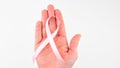 Womans hands holding pink breast cancer awareness ribbon Royalty Free Stock Photo