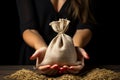 Womans hands showcase abundance with full burlap sack and chart
