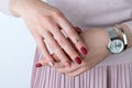 Womans hands with silver jewelry and accessories. Girl with minimal pink spring summer manicure design