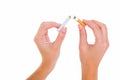 Womans hands snapping a cigarette Royalty Free Stock Photo