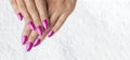 Womans hands with trendy pink with glitter french manicure Royalty Free Stock Photo