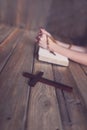 Womans hands with wooden rosary and Holy Bible Royalty Free Stock Photo