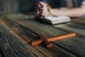 Womans hands with wooden rosary and Holy Bible Royalty Free Stock Photo