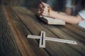 Womans hands with wooden rosary and Holy Bible Royalty Free Stock Photo