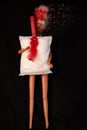 Womans headache during menstruation. Irregular heavy period concept. Doll body with menstrual pad, creative minimalism Royalty Free Stock Photo