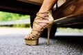 Womans legs in high heels. Luxury urban background. The woman is wearing shoes on high heels. Close up of woman legs