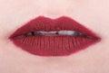 Womans lips with red glossy lipstick