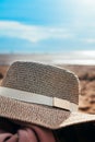 Womans Straw hat on the beach