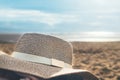 Womans Straw hat on the beach