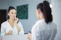 Womem in mirror clean make-up lips Royalty Free Stock Photo